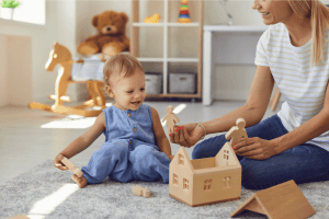 ifp-emotional-connection Mother playing with baby in baby's bedroom
